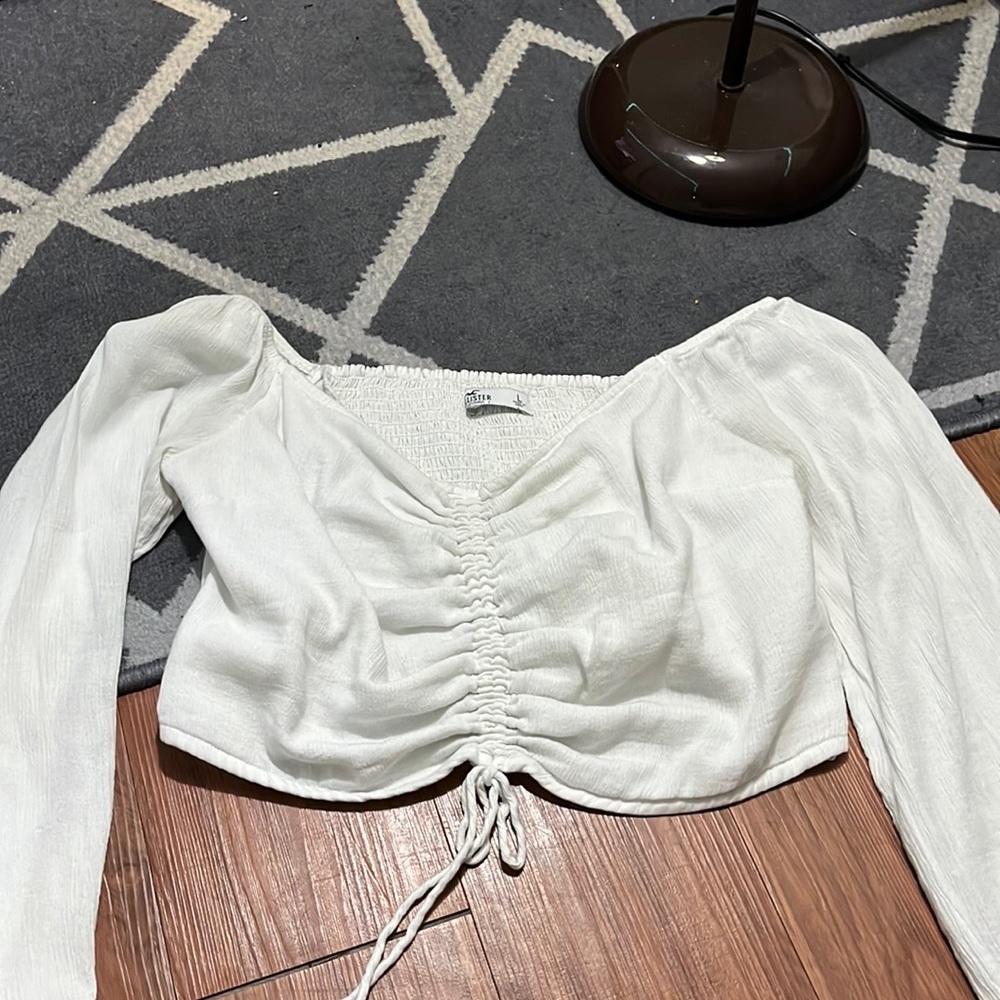 White cinched crop top with flowy bell sleeves